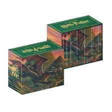 Two identical Harry Potter complete series box sets, green with a detailed illustration of a dragon flying over a dark landscape.